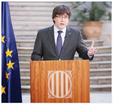  ??  ?? A handout picture released by the Generalita­t de Catalunya shows Catalan regional president Carles Puigdemont, who was officially deposed by Madrid, delivering a speech in Girona on Saturday. (AFP)