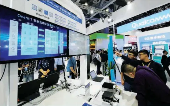  ?? LI ZHIHAO / FOR CHINA DAILY ?? Intel’s 5G products are displayed at a China Mobile global business partner conference in Guangzhou, capital of Guangdong province, on Nov 14, 2019.