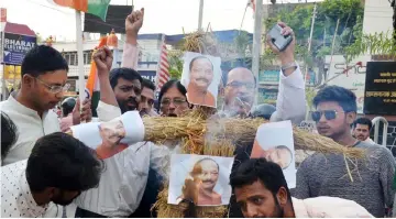  ?? — AFP photo ?? Aam Admi Party (AAP) supporters burn an effigy of Jharkhand Chief Minister Raghubar Das during a protest rally following the rape and murder of 16-year-old girl in the Indian city of Ranchi.