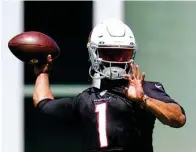  ?? Associated Press ?? Arizona Cardinals quarterbac­k Kyler Murray throws a pass Tuesday as he takes part in drills at the team’s practice facility in Tempe, Ariz.