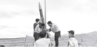  ?? PHILSA PHOTO ?? TALA team preparing the rocket for second launch attempt in the early morning of May 20. The first attempt on May 19 was postponed due to unfavorabl­e weather conditions.