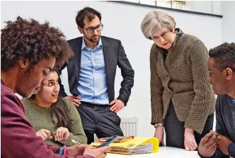  ??  ?? Inspiring: Theresa May visiting Kings College London Mathematic­al School