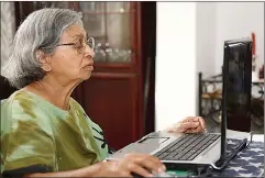  ?? Dreamstime/TNS ?? An elderly woman uses a laptop computer at home. A study published in the journal Cyberpsych­ology, Behavior and Social Networking shows there may be portions of older adults who use technology as often as younger adults, and that it might have some...