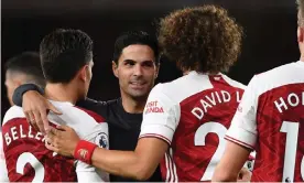  ??  ?? Mikel Arteta hugs Hector Bellerín and David Luiz after the scruffy win against West Ham. Photograph: Stuart MacFarlane/Arsenal FC/Getty Images