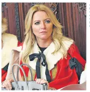  ??  ?? Good Lord: Michelle Mone watches the Queen’s Speech while clutching her £17,000 Hermès Kelly