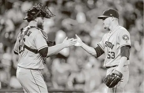  ?? Greg Fiume / Getty Images ?? Closer Ken Giles, right, and catcher Brian McCann celebrate the 8-7 victory over the Orioles at Oriole Park at Camden Yards on Friday night. Giles came on for the final out after the bullpen allowed the Orioles to get back in the game with five runs in...