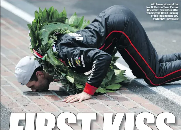  ?? GETTY IMAGES ?? Will Power, driver of the No. 12 Verizon Team Penske Chevrolet, celebrates after winning the 102nd Running of the Indianapol­is 500 yesterday.