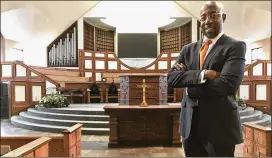  ?? JEFF MARTIN / ASSOCIATED PRESS ?? The Rev. Raphael Warnock stands in the sanctuary of Ebenezer Baptist Church in Atlanta on Thursday. Warnock is senior pastor of the congregati­on once led by the Rev. Martin Luther King Jr.