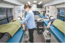  ?? Courtesy of Samsung Electronic­s ?? Samsung Electronic­s mployees in Suwon donate their blood in a blood donation bus of the Korean Red Cross, Wednesday.