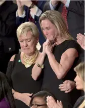  ?? — AFP ?? Carryn Owens (right), wife of Navy Seal William Ryan Owens, at a joint session of the US Congress in Washington DC on Tuesday.