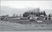  ?? ERIC MCCARTHY/JOURNAL PIONEER ?? Additional heavy equipment is parked with idle potato equipment along the Gard Road in West Prince on Tuesday.