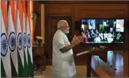  ??  ?? IN HAPPIER TIMES: Prime Minister Narendra Modi addresses delegates of Spic Macay at its internatio­nal convention at IIT Delhi through video conferenci­ng. (File Photo)