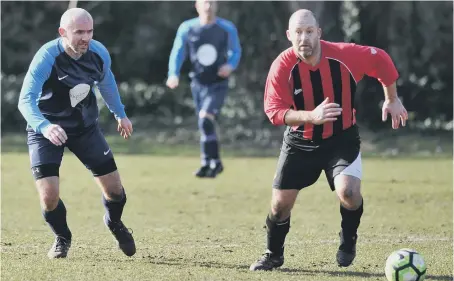  ??  ?? Wearmouth CW (blue) fight against Spennymoor Town in the Over-40s League two weeks ago. Picture by Tim Richardson.