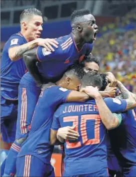  ?? REUTERS ?? Colombia's Radamel Falcao (extreme left) celebrates with teammates after scoring the second goal against Poland on Sunday.