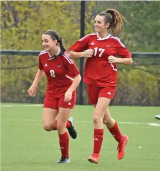  ?? STAFF FILE PHOTO BY PATRICK MACCOON ?? Signal Mountain senior Camilla Mincey, left, and Kara Wilson celebrate one of 10 goals in a sectional win over York Institute. The Lady Eagles and GPS Bruisers will try to defend their state titles this week in Murfreesbo­ro.