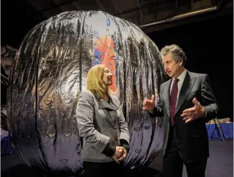  ??  ?? ABOVE: One-time NIDS founder Robert T Bigelow shows off the Bigelow Expandable Activity Module (BEAM), intended for use at the Internatio­nal Space Station, to NASA Deputy Administra­tor Lori Garver in 2012. ABOVE RIGHT: Vernal, Utah, home not just to...