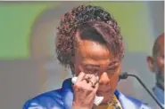  ?? AP PHOTO/JOHN BAZEMORE ?? Bernice King, daughter of civil rights leader Martin Luther King Jr., wipes a tear as she speaks about her brother, Dexter Scott King, during a news conference Tuesday in Atlanta.