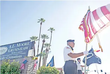  ?? — AFP photo ?? Honour guard David Carrasco, 78, of Phoenix, Arizona stands with the flag outside the AL Moore-Grimshaw Mortuary in Phoenix, Arizona where the body of McCain is being held.