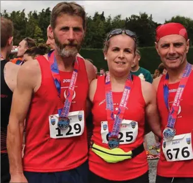  ??  ?? John Cooper (129), Martina O’Connor Dyas and John Reilly at the Tullamore Half Marathon.