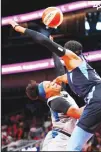  ??  ?? Minnesota Lynx guard Odyssey Sims (1) is fouled by Atlanta Dream guard Brittney Sykes (right), during the first half of a WNBA basketball
game on Aug 6 in Atlanta. (AP)