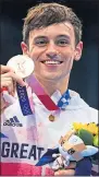  ??  ?? Tom Daley with his bronze medal