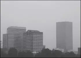  ?? AP PHOTO ?? The downtown skyline is visible through hazy smoke from wildfires in Portland,