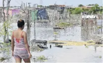  ?? PHOTO: GETTY IMAGES ?? Devastatio­n . . . A resident of the Nuevo Paraiso neighbourh­ood on the island of Belen looks at the flooded site where houses existed after the passage of Hurricane Iota on in Cartagena, Colombia this week.