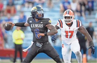  ?? ?? Kansas football quarterbac­k Jalon Daniels throws a pass during a game against Illinois on Sept. 8 in Lawrence.