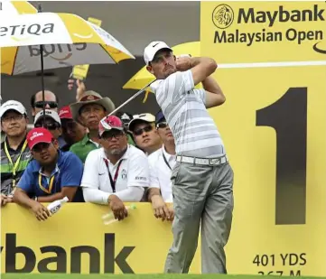  ??  ?? Over the last decade the Maybank Malaysian Open has featured numerous world-class stars like Charl schwartzel (left) of south Africa. spectators and players walk the course during a Maybank Malaysia Open.