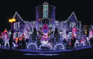  ?? DAVE SIDAWAY ?? Sami Hajjar’s Frozen-inspired Christmas lights display took 300 hours to set up at his parents’ Jean-Bourdon Ave. home. He estimates he’s spent $50,000 to date this year, not including the hydro bill.