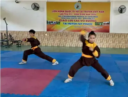  ?? VNS Photo Lê Hương ?? GOOD FORM: Bình Định martial art students train both their physical and mental health.