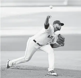  ?? DAVID J. PHILLIP/AP ?? Astros starter Josh James throws against the Mariners during the first inning of Monday’s game in Houston. James got to pitch against José Marmolejos, his high school teammate atSouth Broward.