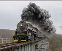  ?? Adam Kuczynski ?? NEW LIFE In its second run since its return to operation, Reading & Northern 4-8-4 No. 2102 storms across Hometown Trestle near Nesquehoni­ng, Pa., on April 26, 2022. The trip with 50 coal hoppers was a final test before the engine begins excursion trips in May.