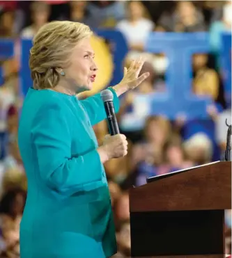  ??  ?? FLORIDA: In this Oct 26, 2016 file photo, members of the audience hold signs that spell out “Florida” as Democratic presidenti­al candidate Hillary Clinton speaks at a rally in Lake Worth. — AP