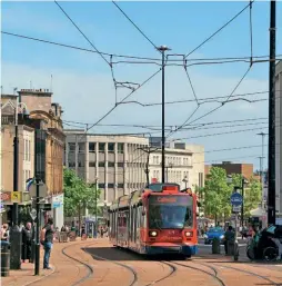  ?? ?? Modern overhead wire constructi­on on Crich’s near neighbour, the Sheffield Supertram, as tram 119 approaches Cathedral. Can modern equipment such as this be used in a museum setting? HUGH DOUGHERTY