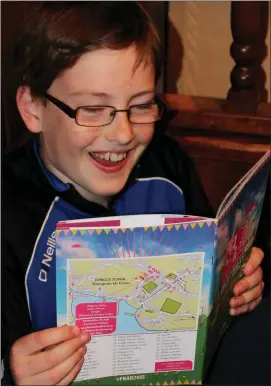  ??  ?? Good reading: Odhran Slattery studying the contents of the Féile na Bealtaine programme which was launched on Saturday night.