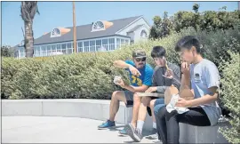  ?? DAI SUGANO — STAFF PHOTOGRAPH­ER ?? From left, Allan Chan, his sons, Alex, 15, and Nicholas, 13, and his wife, Maria Yuin, have lunch at the Port of Redwood City on June 18.