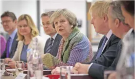  ??  ?? LONDON: British Prime Minister Theresa May (center) holds a regional Cabinet meeting in Runcorn, north west England yesterday. May launched proposals for a modern Industrial Strategy to build on Britain’s strengths and tackle its underlying weaknesses...