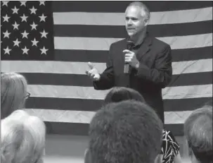  ?? The Associated Press ?? TOWN HALL MEETING: In this July 25, 2016, file photo, then-Rep. Tim Huelskamp, R-Kan., speaks during a campaign town hall meeting at the headquarte­rs of Patriot Outfitters, which sells firearms, accessorie­s and hunting and military gear in St. Marys,...