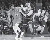  ?? ERIC HARTLINE USA TODAY NETWORK ?? Celtics forward Jayson Tatum steals the ball from 76ers center Joel Embiid during Game 3 on Friday night.