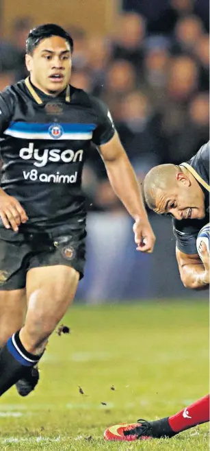  ??  ?? Held back: Scarlets’ Tom Prydie gets to grips with Bath’s Jonathan Joseph