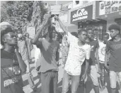  ?? MARWAN ALI/AP ?? People protest amid demonstrat­ions against a military takeover Thursday in Khartoum, Sudan.