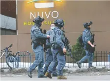  ?? DARREN MAKOWICHUK ?? Calgary police investigat­e an officer-involved shooting on Wednesday afternoon at the Nuvo Hotel on 12th Ave. S.W.