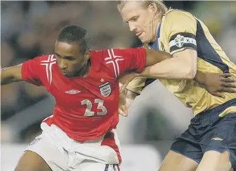  ??  ?? Sweden defender Johan Mjallby (right, challengin­g Jermain Defoe) used snus a lot – as many did and do!