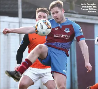  ??  ?? Kevin Farragher shields the ball from an Athlone forward.