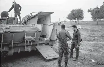  ?? ILIA YEFIMOVICH USA TODAY NETWORK ?? Israeli soldiers gather near an artillery unit along the southern border of Israel and Gaza as fighting between Israeli troops and Islamist Hamas militants continues.