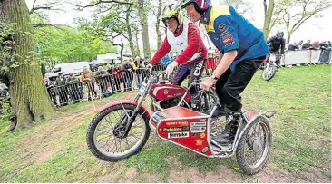 ??  ?? Nick Jefferies gamely has a go as sidecar ballast in a 350cc Bultaco rig at the Stafford Show.