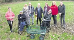  ??  ?? Volunteers ready to help create the new garden