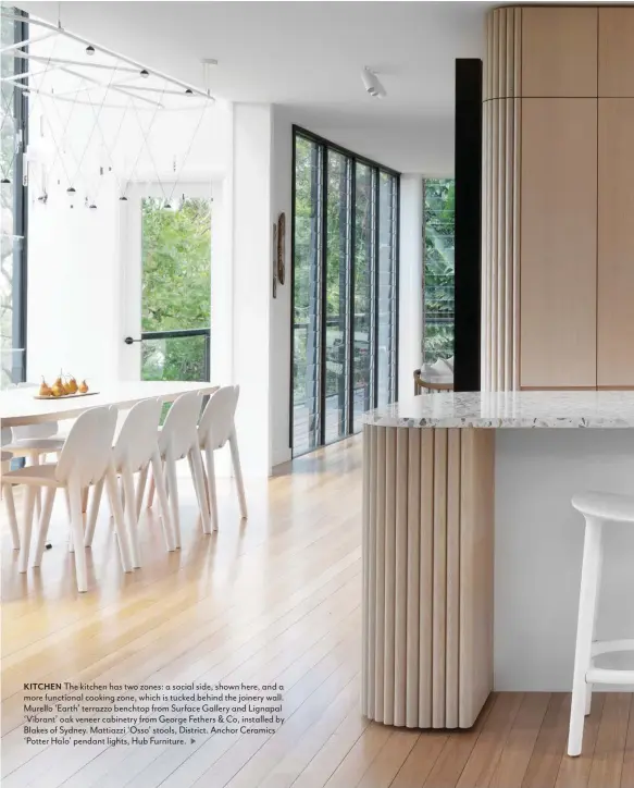  ??  ?? KITCHEN The kitchen has two zones: a social side, shown here, and a more functional cooking zone, which is tucked behind the joinery wall. Murello ‘Earth’ terrazzo benchtop from Surface Gallery and Lignapal ‘Vibrant’ oak veneer cabinetry from George Fethers & Co, installed by Blakes of Sydney. Mattiazzi ‘Osso’ stools, District. Anchor Ceramics ‘Potter Halo’ pendant lights, Hub Furniture.