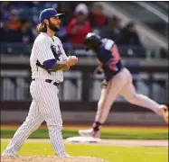  ?? John Minchillo / Associated Press ?? New York Mets starting pitcher Trevor Williams walks back to the mound after giving up a two-run home run to the Atlanta Braves’ Guillermo Heredia in the eighth inning on Wednesday.